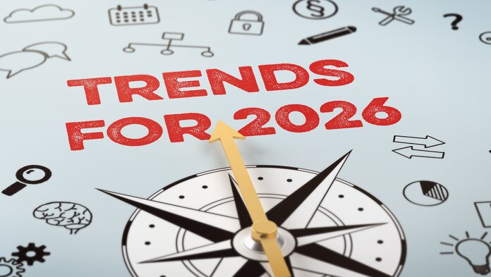 Eine Kompassnadel zeigt auf den Text "Trends für 2026" – darum herum verschiedene Icons die Wissenschaft, Recht und Medizin symbolisieren.
